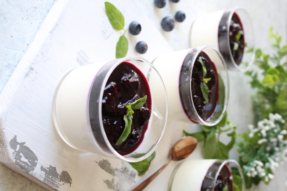Yogurt panna cotta with blueberries and basil sauce